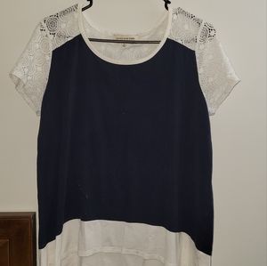 Navy blue and white blouse with mesh detailing.